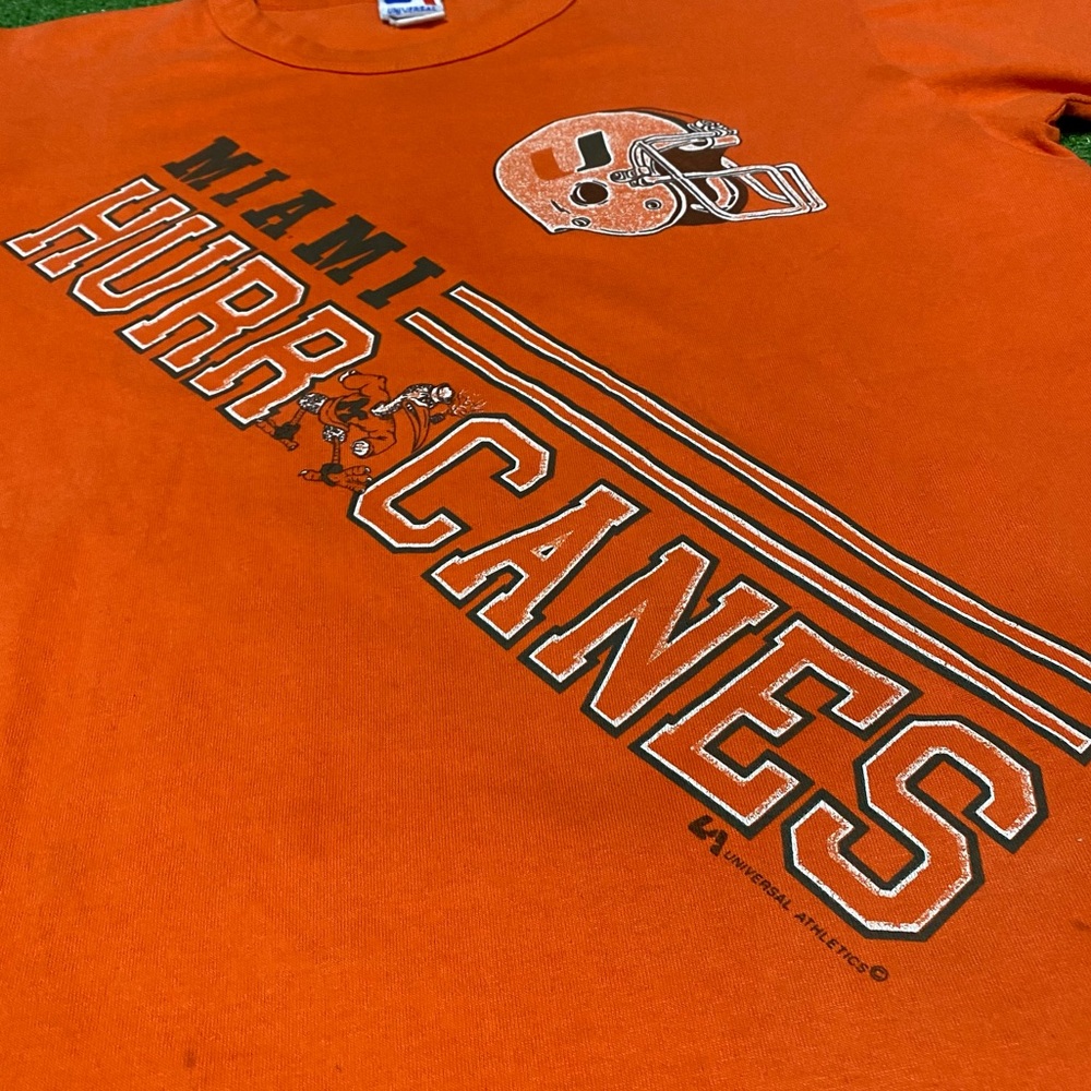 Vintage 80s Miami Hurricanes Universal Athletics T-Shirt USA Green Orange Canes